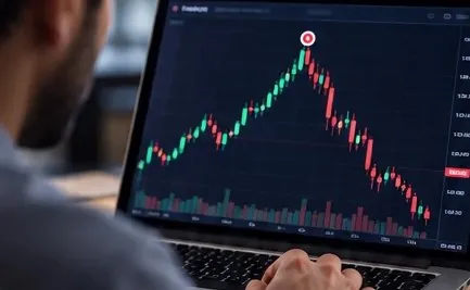 A trader watching a chart fall right after a spike